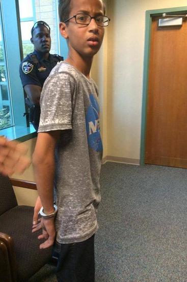 Ahmed Mohamed, A 14-year-old North Texas student, appears in handcuffs, after his arrest on charges of making a “hoax bomb.”